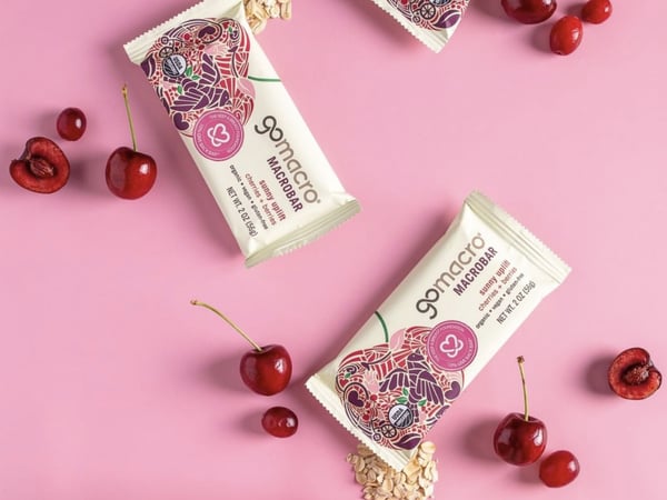 GoMacro bars and cherries on a pink background