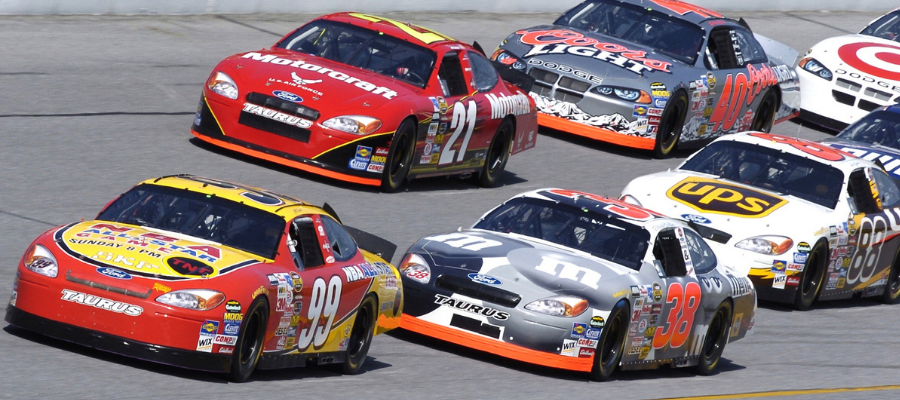 race cars driving on track