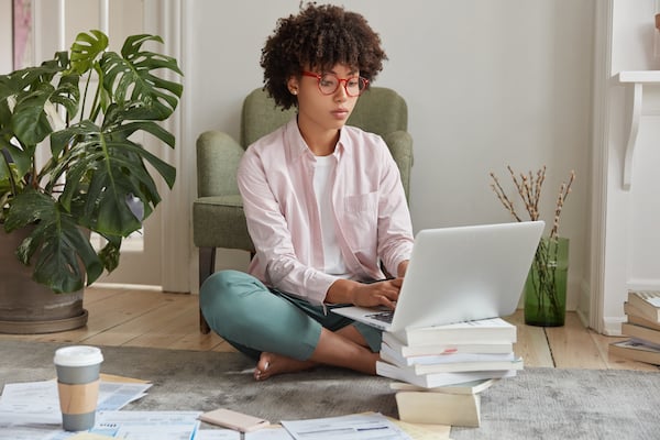 An influencer marketing manager working on a laptop.