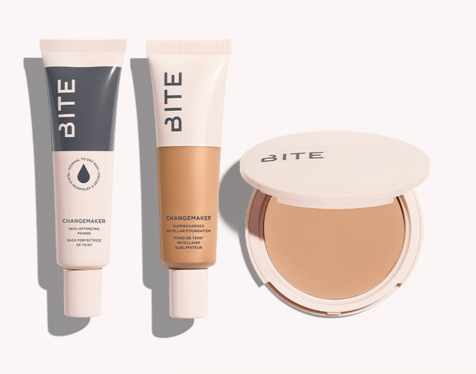 A flat-lay featuring Bite Beauty’s new Changemaker Complexion System of foundation and primer products.