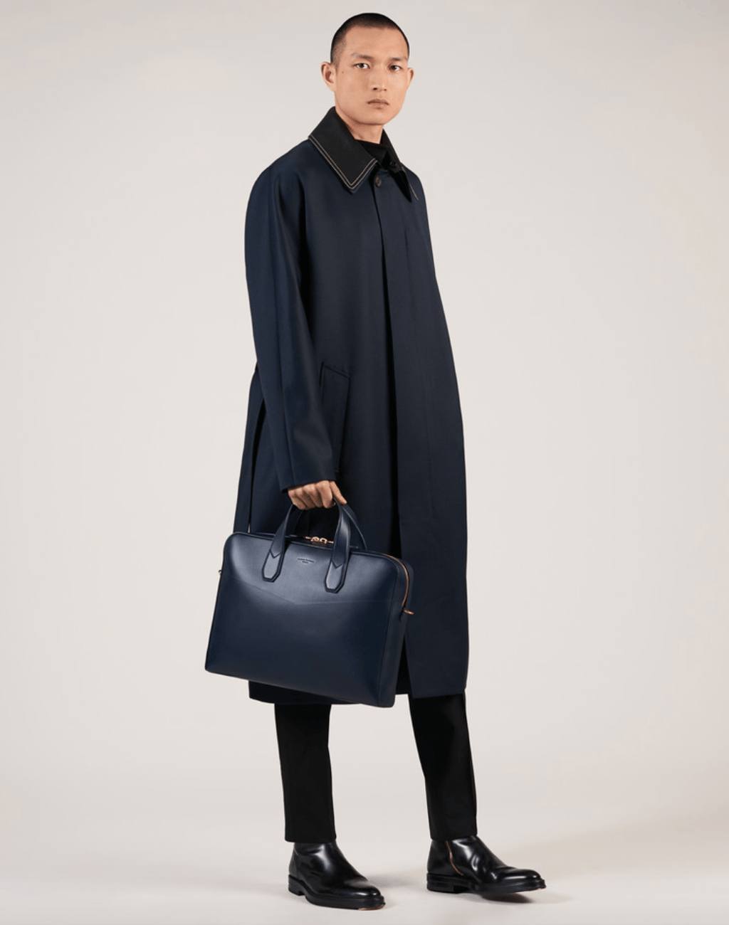 A model poses in an outfit from Dunhill.