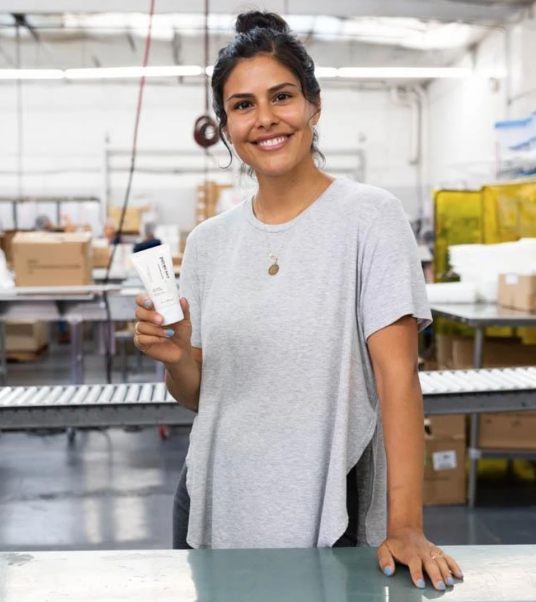 Blogger Jeannette Ogden holding her Sea Kale Clay Mask collaboration with cocokind.
