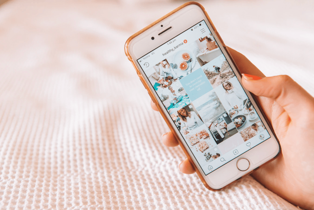A photo by Maddi Bazzocco of an iPhone displaying an influencer's Instagram feed.