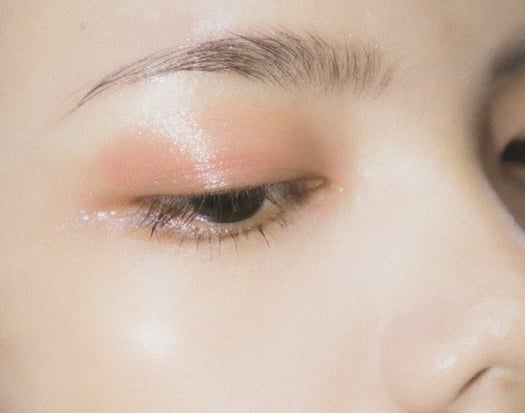 An influencer showing off a dewy eyeshadow look.