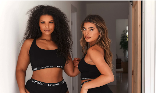Two models wearing Lounge Underwear bra and underwear sets.
