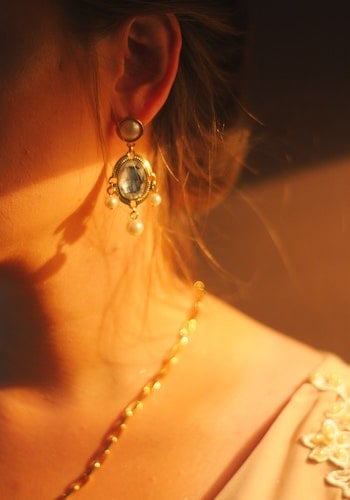 A profile of a woman wearing high jewelry, by Ruan Richard.