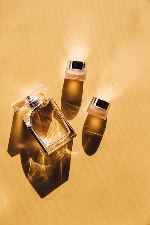 a gold perfume and other beauty products