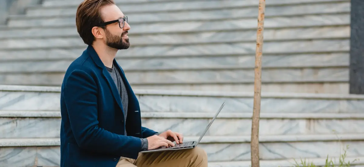 handsome-busy-bearded-man-working-in-park-6E9NX5S 1