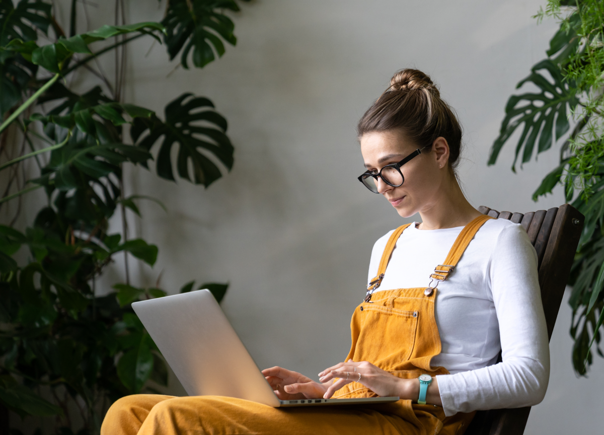 focused-millennial-woman-gardener-watching-educati-GUNJN2U