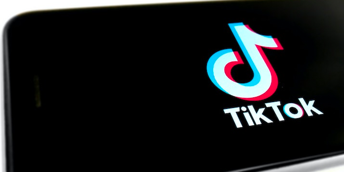 A smartphone displaying the TikTok logo, by Franck. 