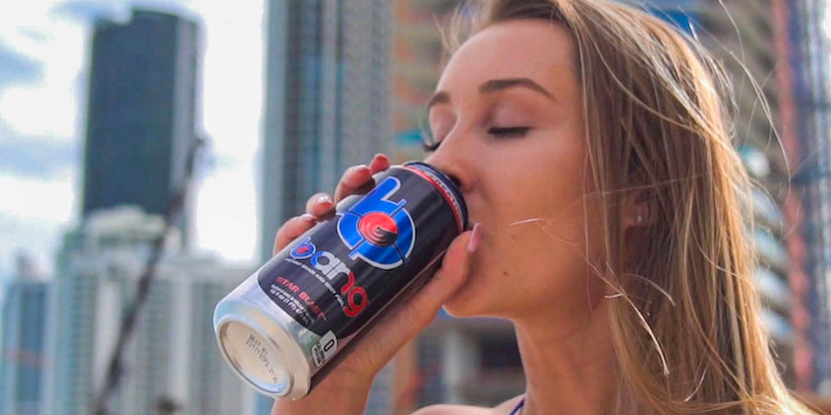 A Gen Z influencer drinking Bang Energy in front of a city skyline. (Source: bangenergy.com)