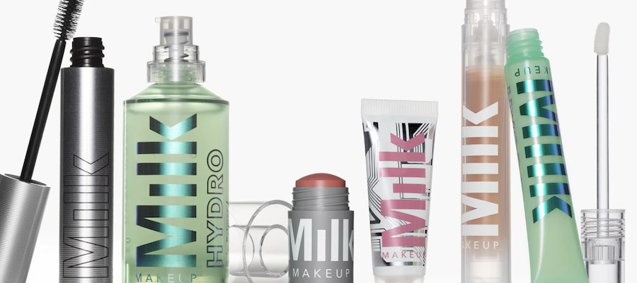 Various Milk Makeup beauty products arranged against a white background, via milkmakeup.com.