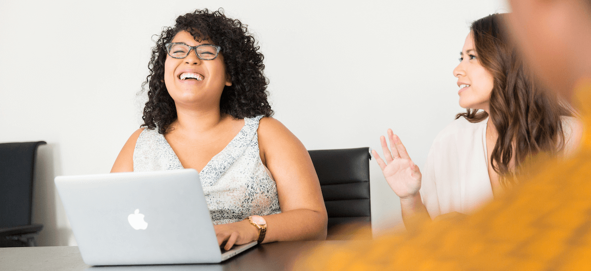 women-laughing-in-meeting