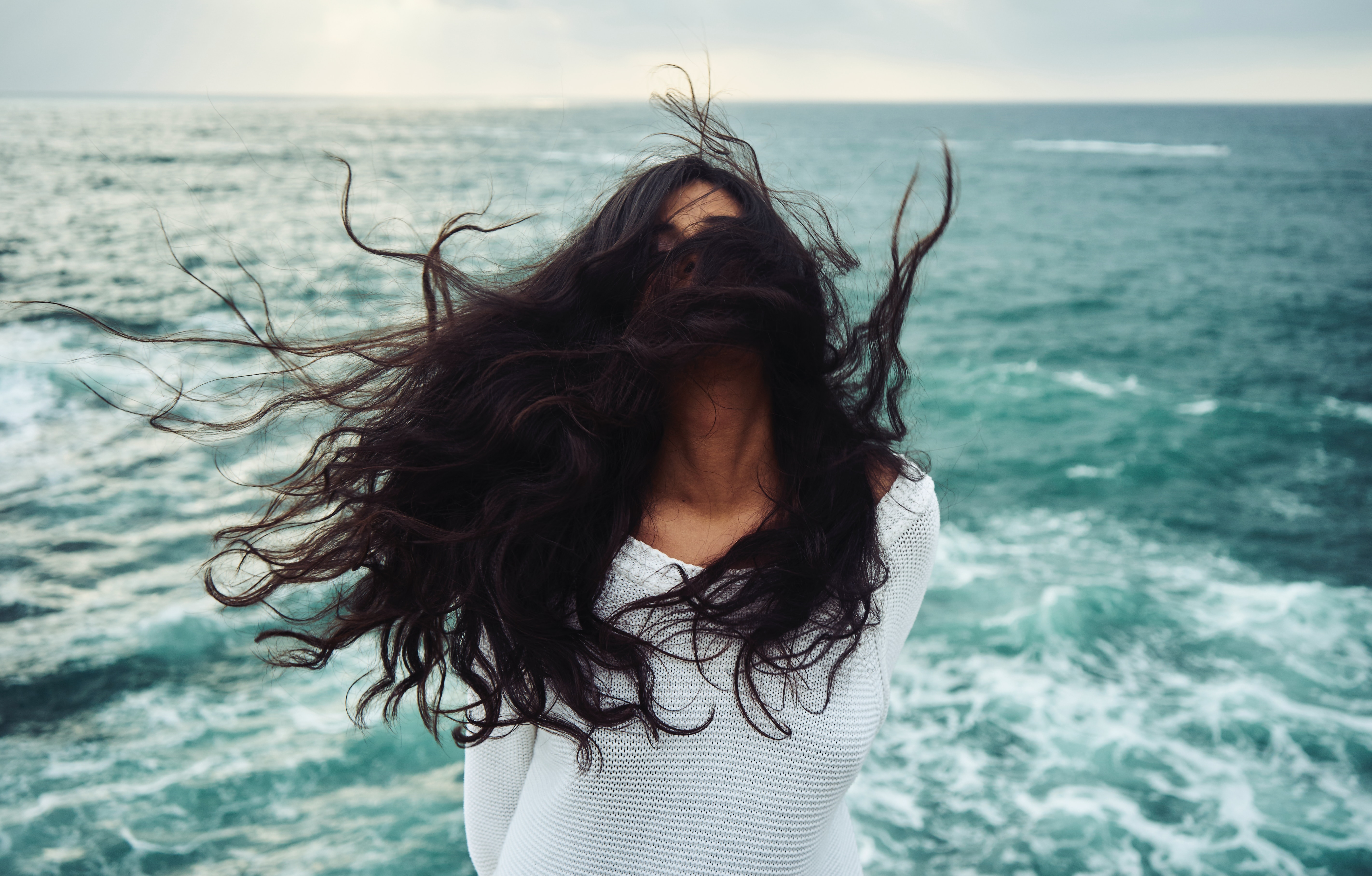 A woman embraces her natural hair. 